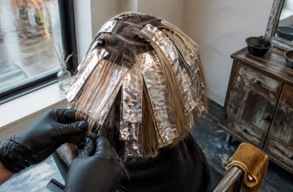 Hair with lightened strands distributed across the head